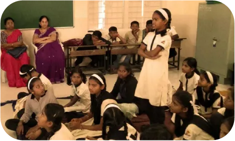 Young student speaking during a classroom activity on digital learning